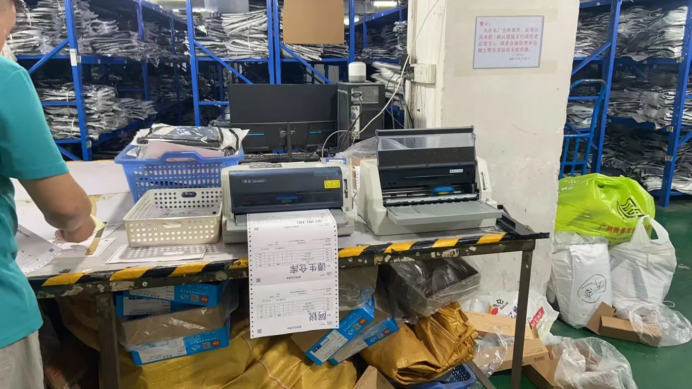A workstation and stored garments in the preparation area.